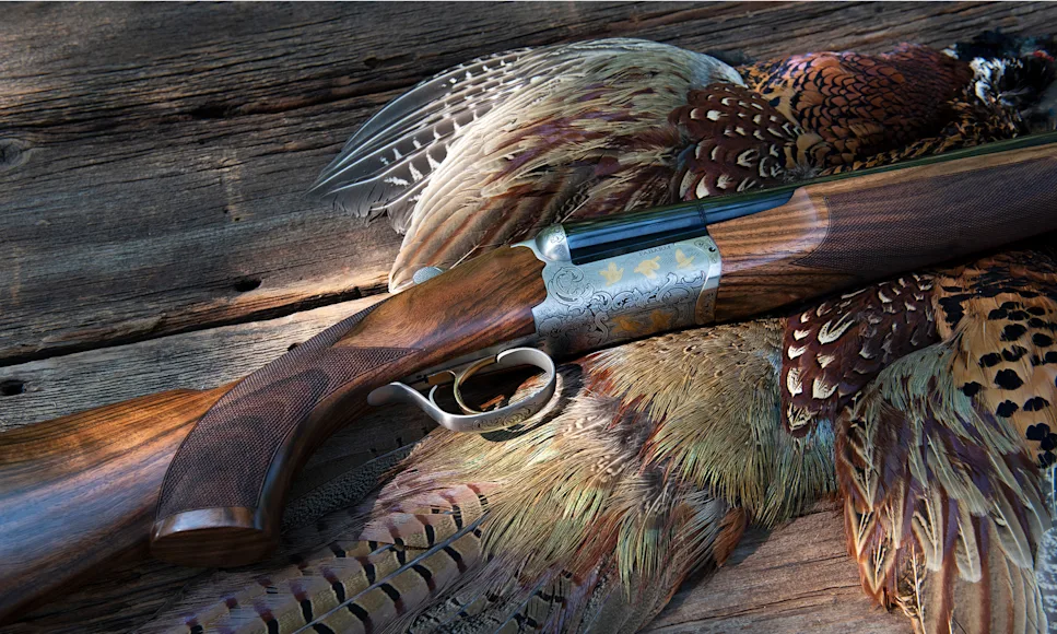 Fabarm Autumn Elite side-by-side shotgun on a pheasant pelt.