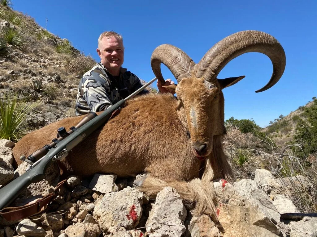 photo of hunter with sheep