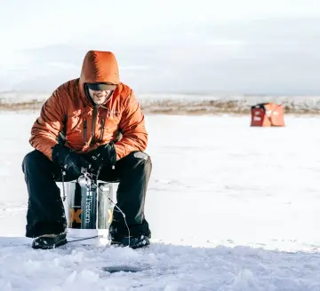 Ice angler fishing