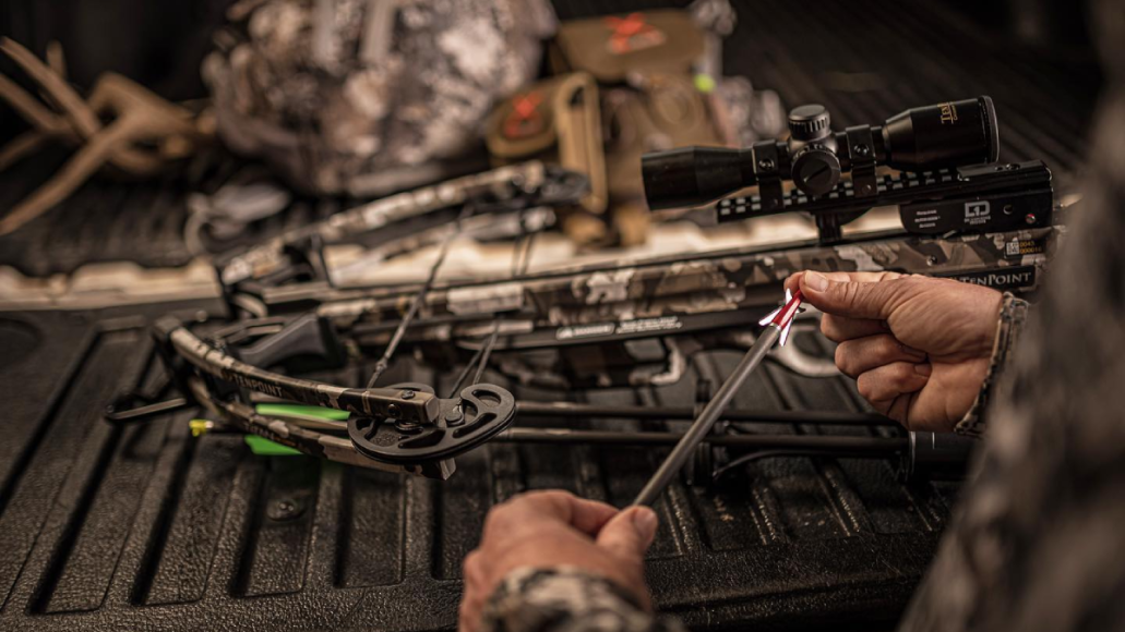 Man holding TenPoint Broadhead Crossbow Bolt