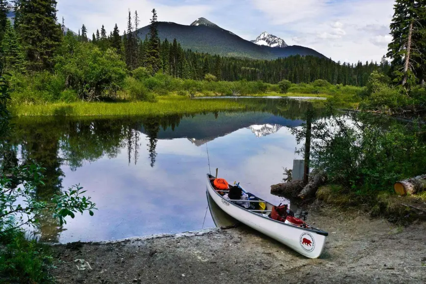 A packed canoe on the shore in Bowron Lake Provincial Park, of Canada.