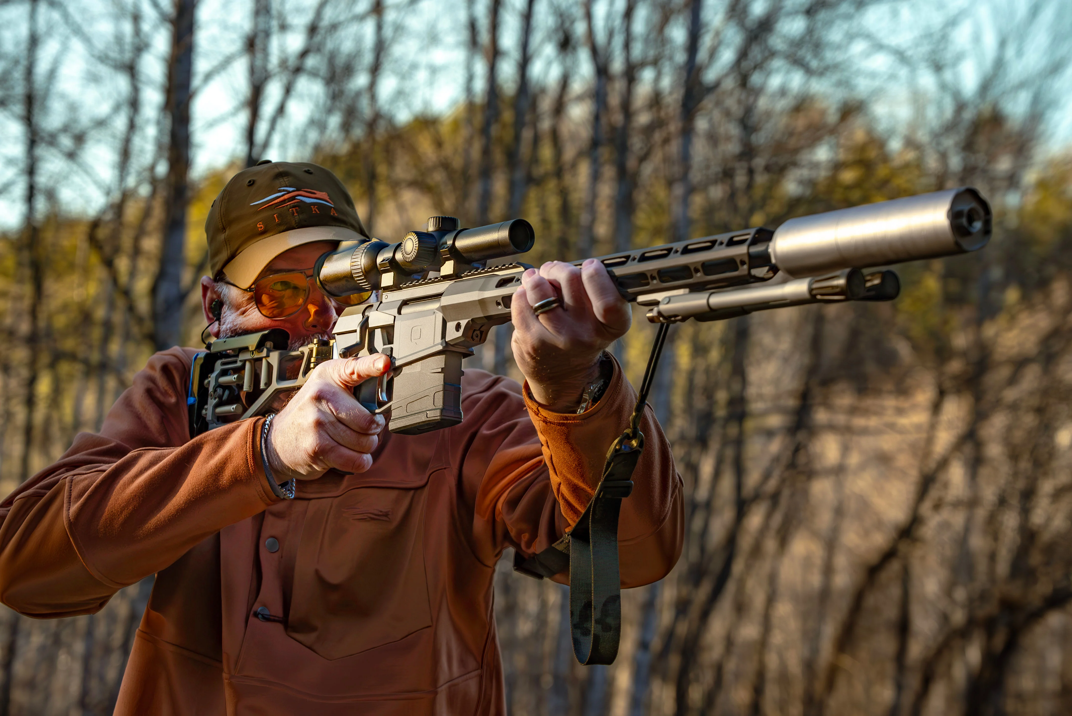 A shooter fires the new Q Fix rifle from an offhand position. 