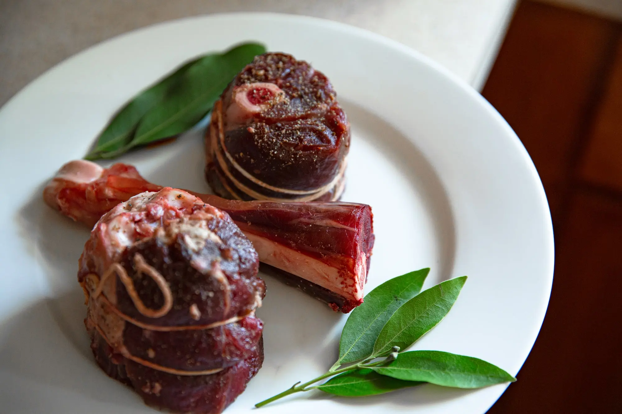 Venison shanks tied with twine.