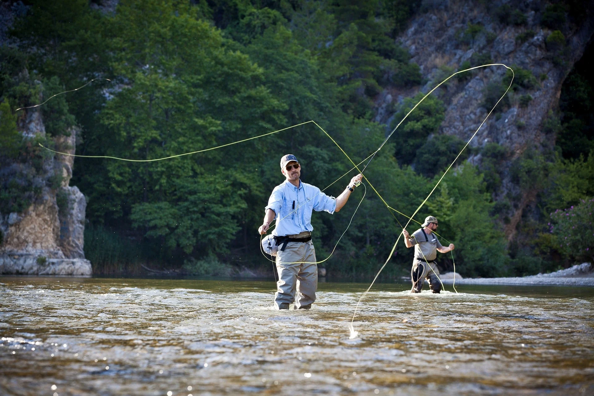 Man fly fishing in a river.