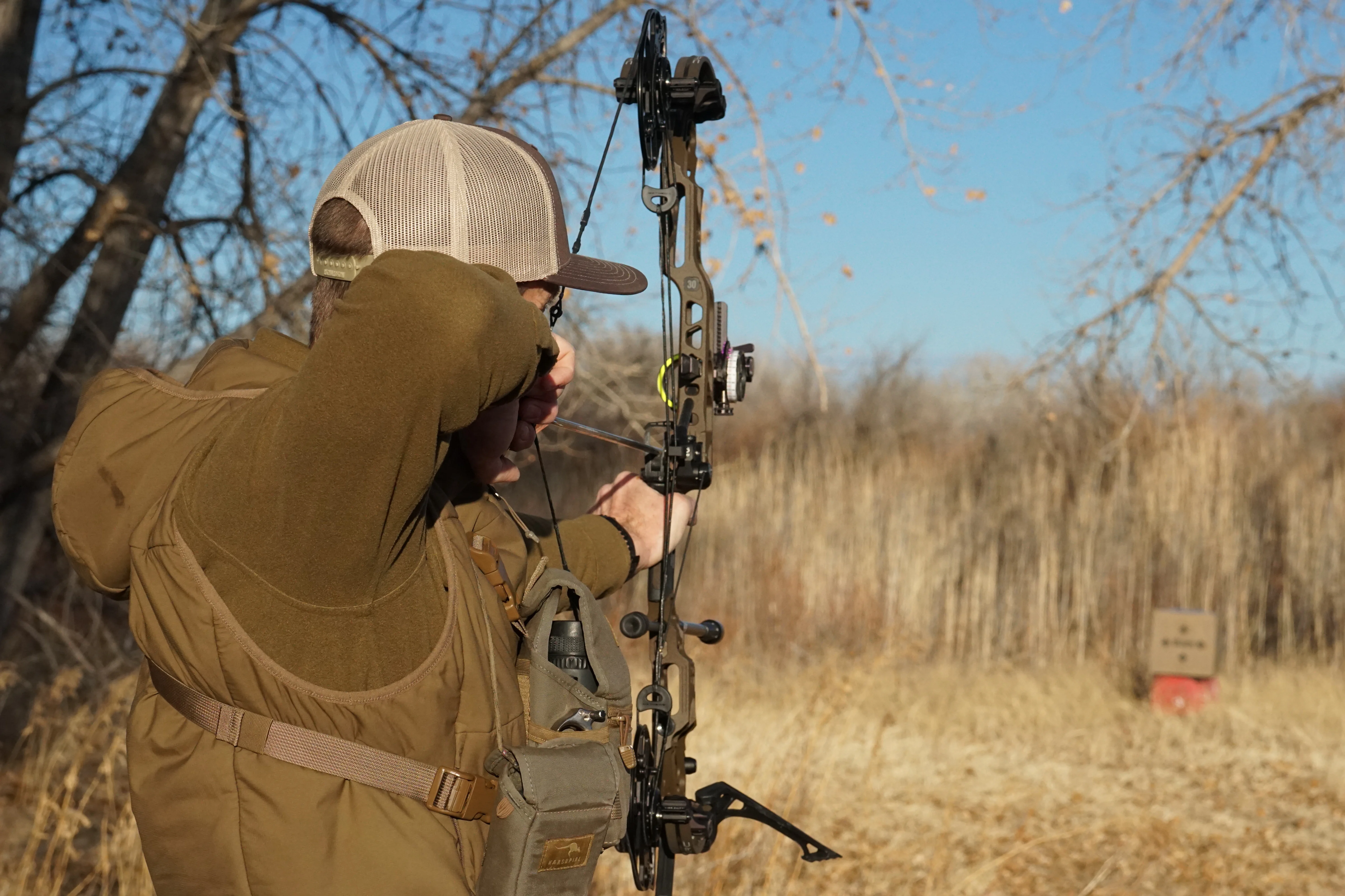 A bowhunter shoots the new Mathews ARC 30 compound bow in the field. 