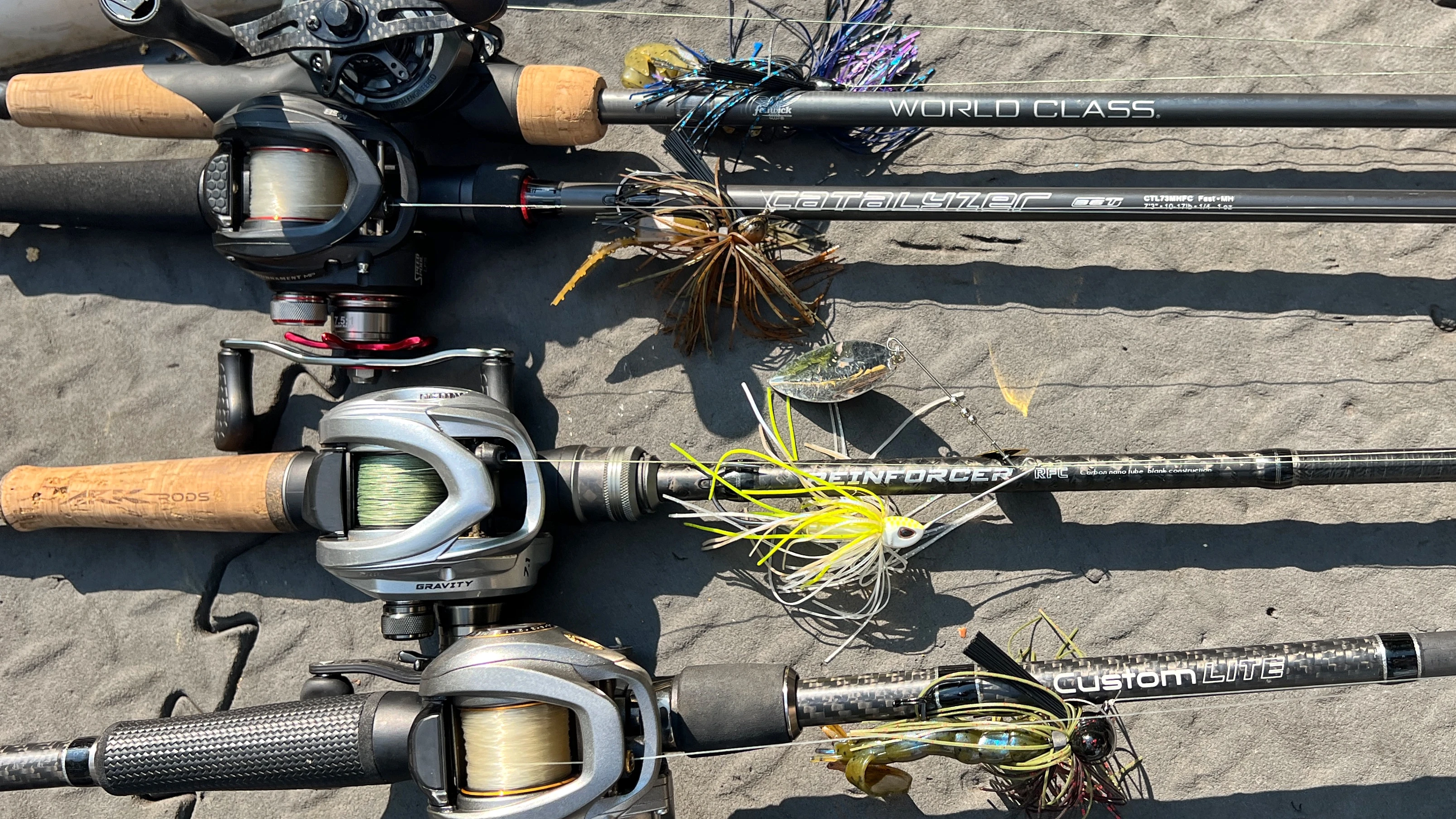 Four baitcasting rods on the deck of a boat