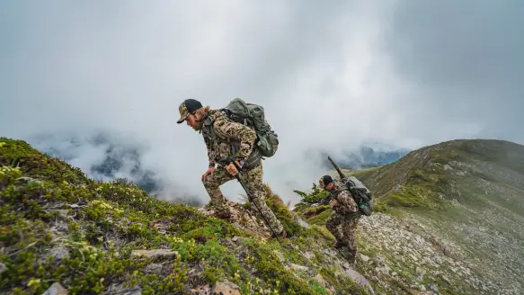 Photo of hunters ascending up a mountain during a western hunt