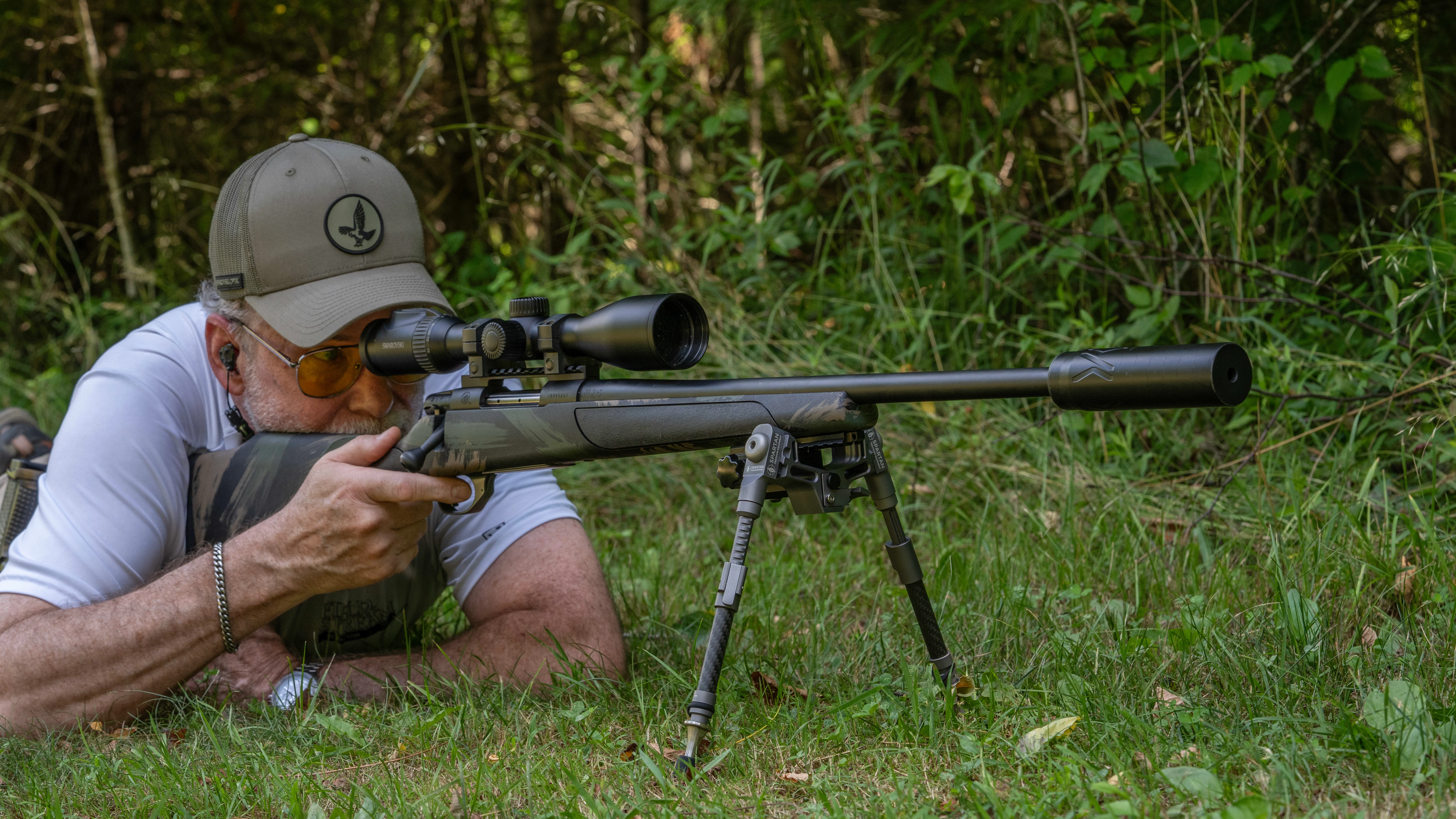 A shooter fires the new Weatherby Vanguard Black Hills rifle from the prone position.