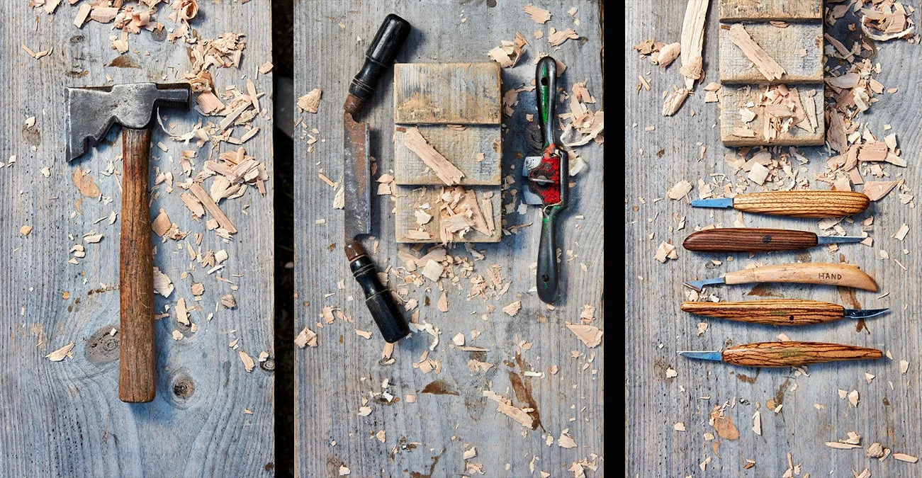 carving tools on a wooden surface. 