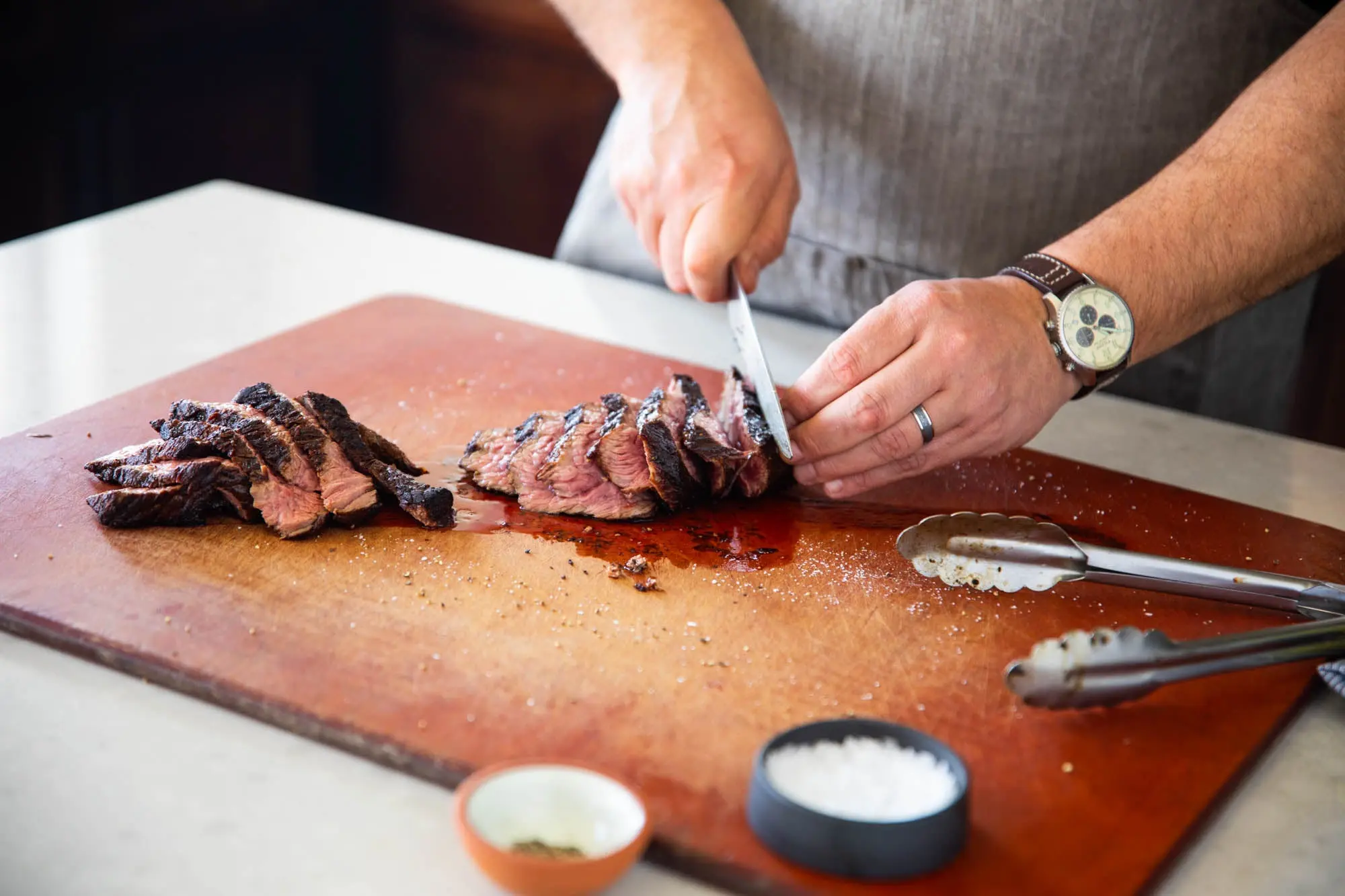 Man preparing Porter Road beef on cutting board