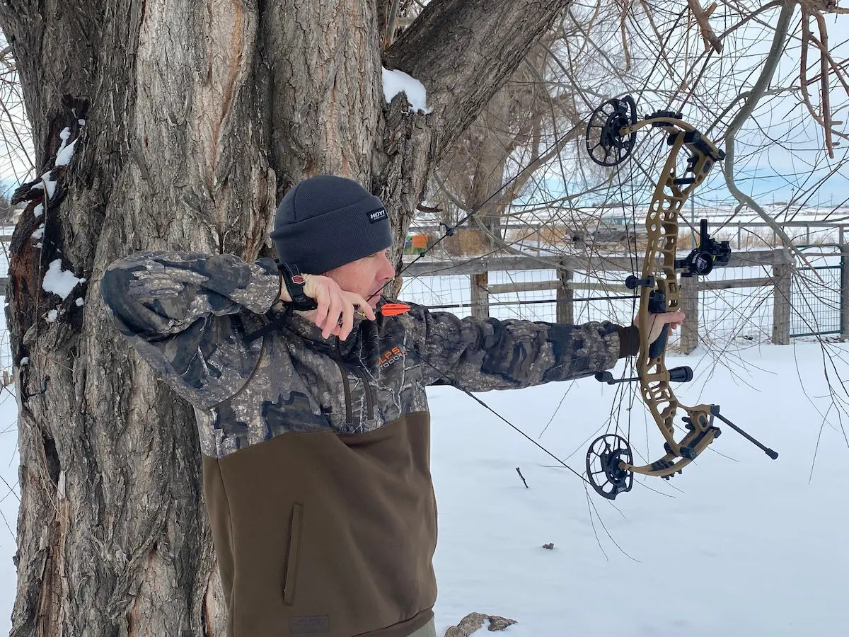 man shooting a bow