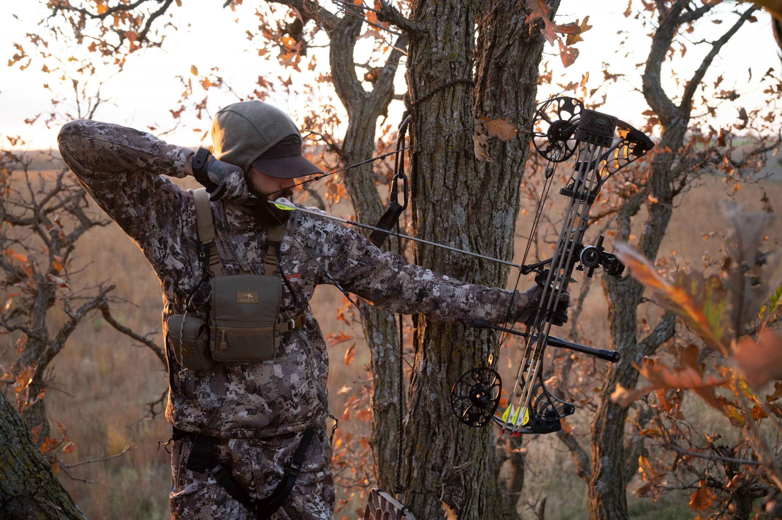 photo of bowhunter at full draw showing draw length