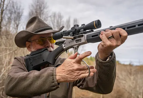 A shooter works the lever of the new Marlin 1895 Trapper Magpul rilfe. 