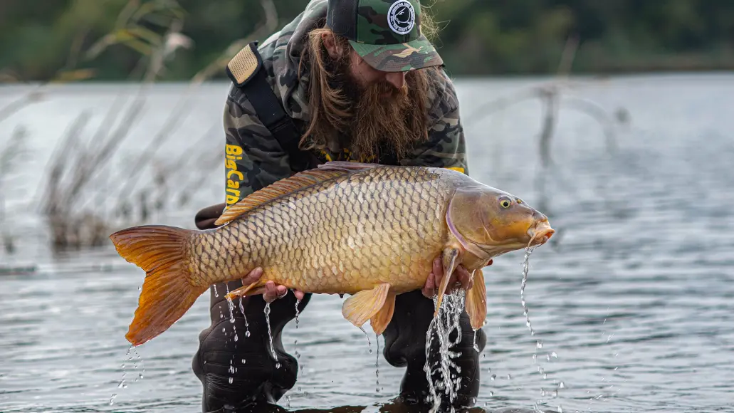 photo of angler with big carp