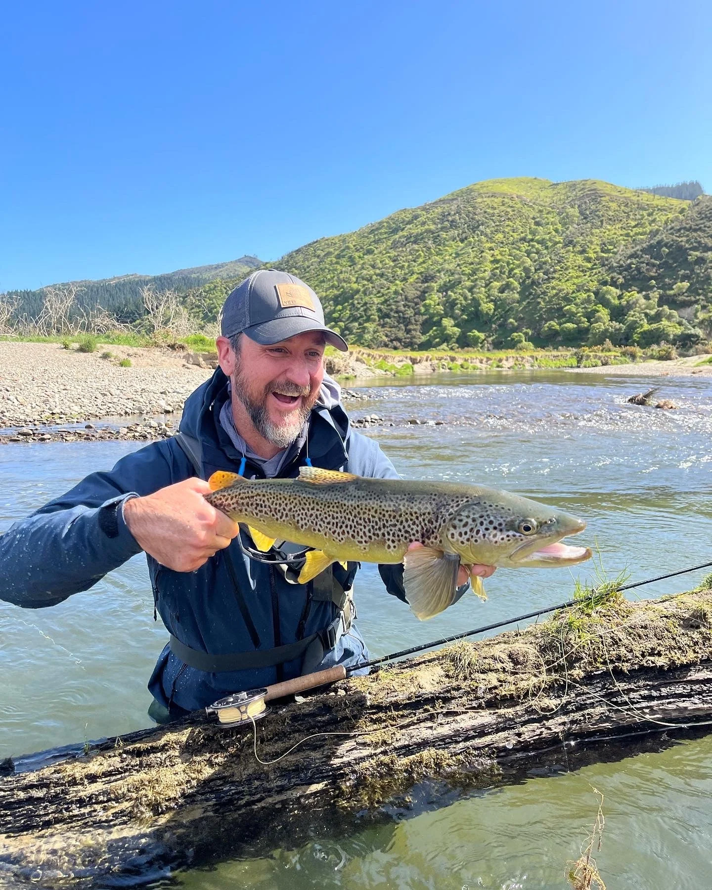 photo of western angler with a big brown trout