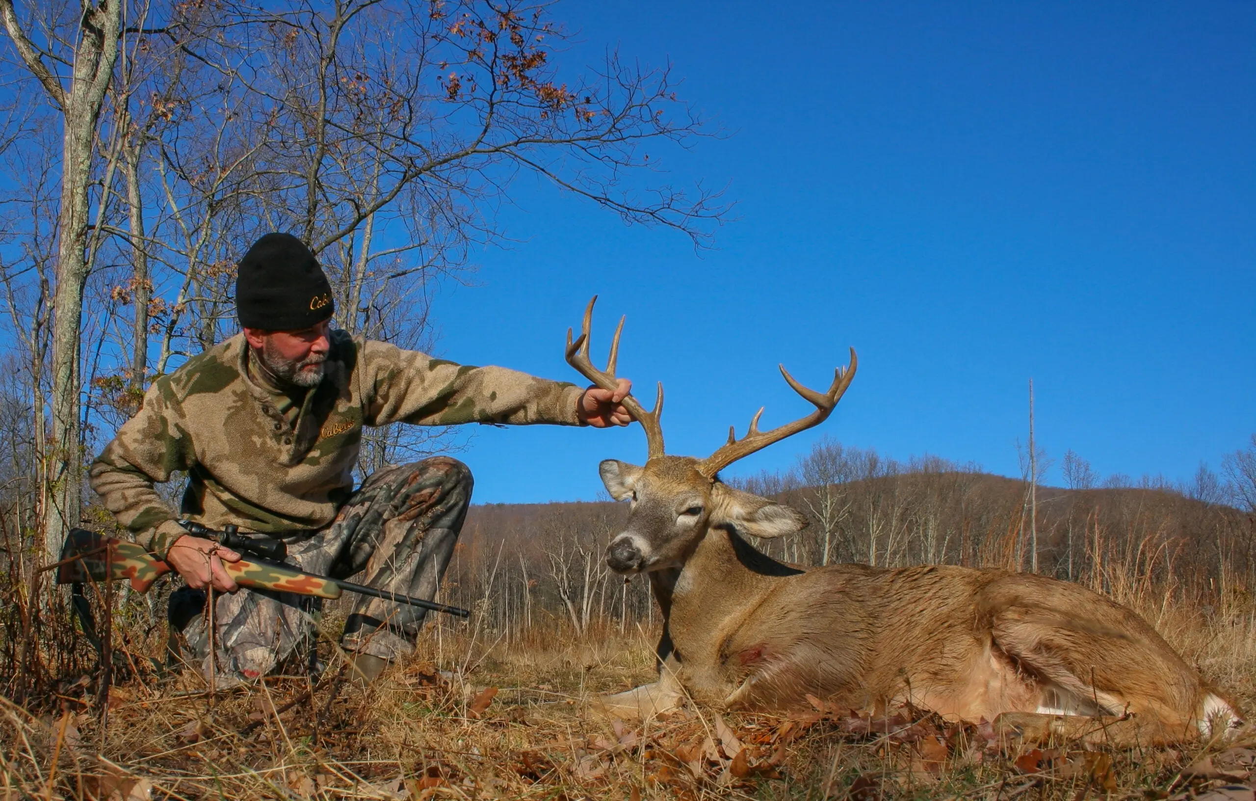 photo of hunter with deer