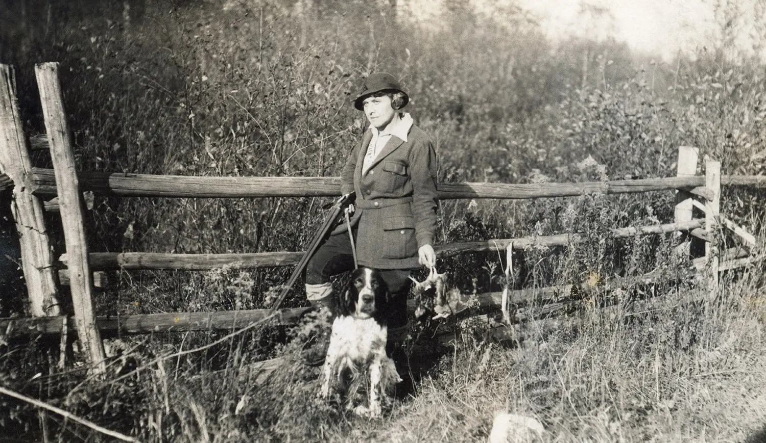 A hunter with her hunting dog