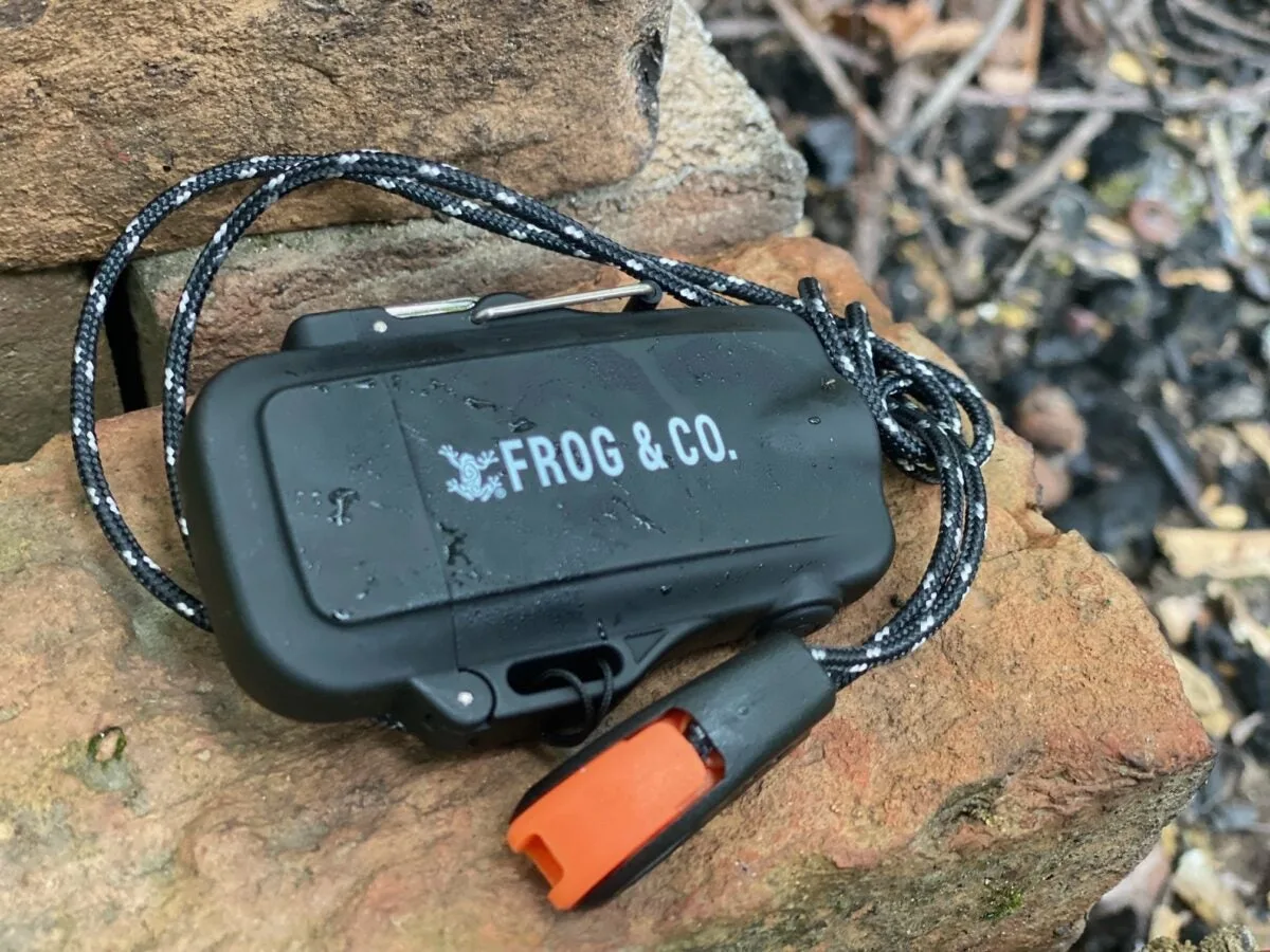 Survival Frog Tough Tesla Lighter 2.0 sitting on rock