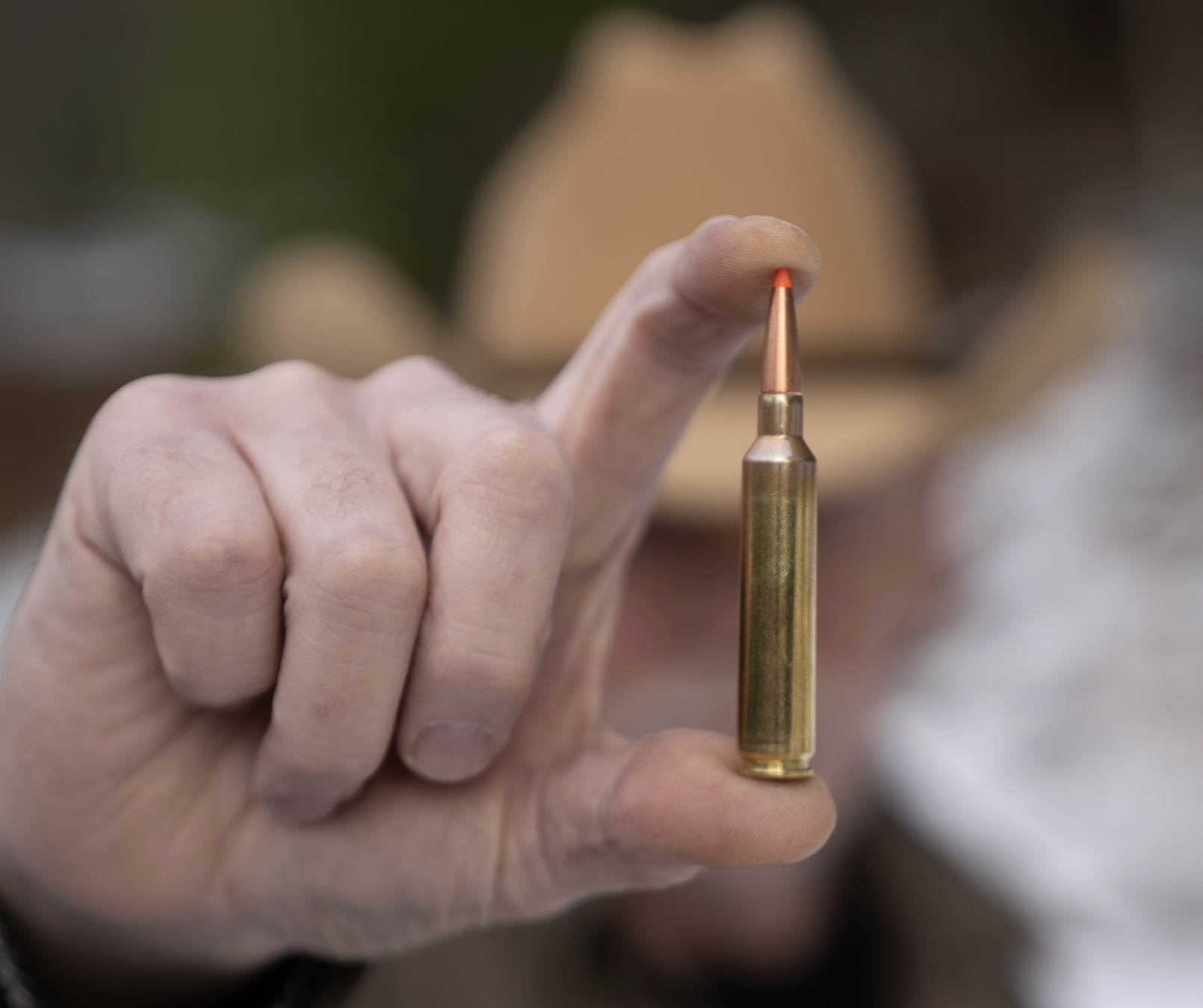 A marksman displays  Weatherby’s new 25 RPM cartridge. 
