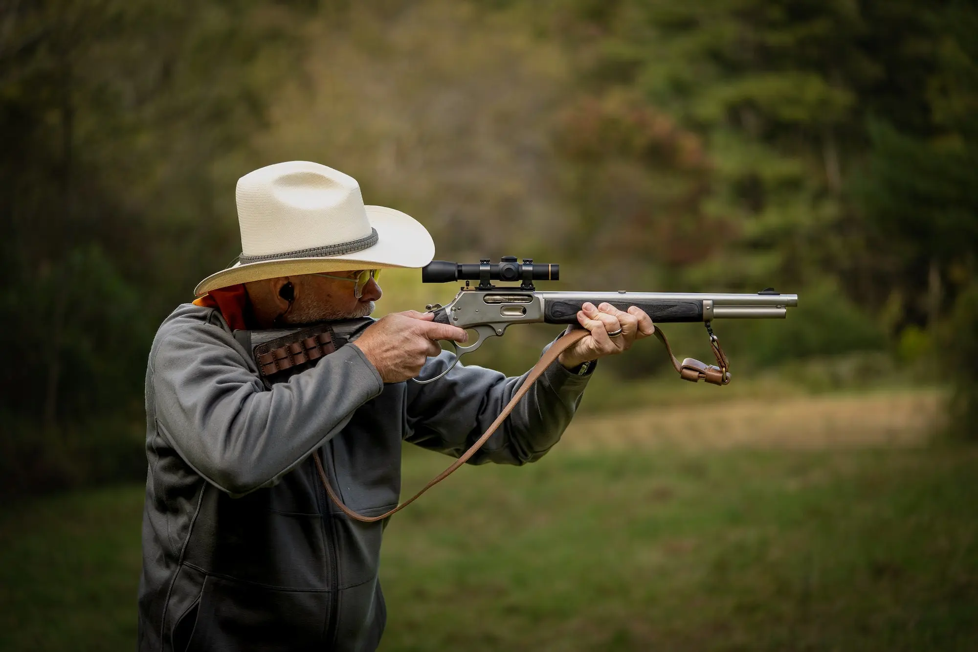 Man shooting a Marlin 1895 lever action rifle.