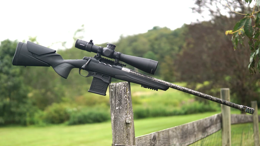 The new Browning X-Bolt 2 Target Competition Lite rifle balanced on a post with farmland in background. 