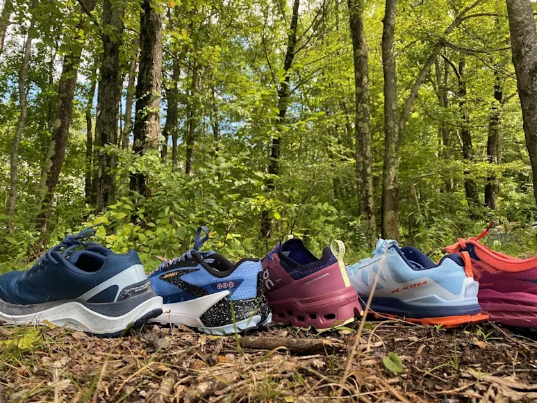 The best trail running shoes lined up on a hiking trail