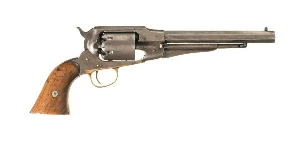 A exposed-hammer W.W. Greener shotgun on a white background.