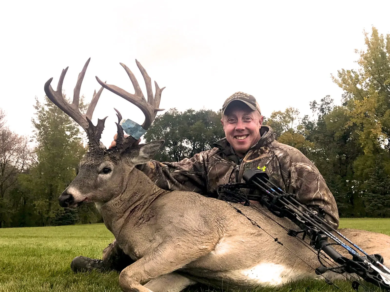 Whitetail deer hunting guide Joel Artis with poses with a big Wisconsin buck. 