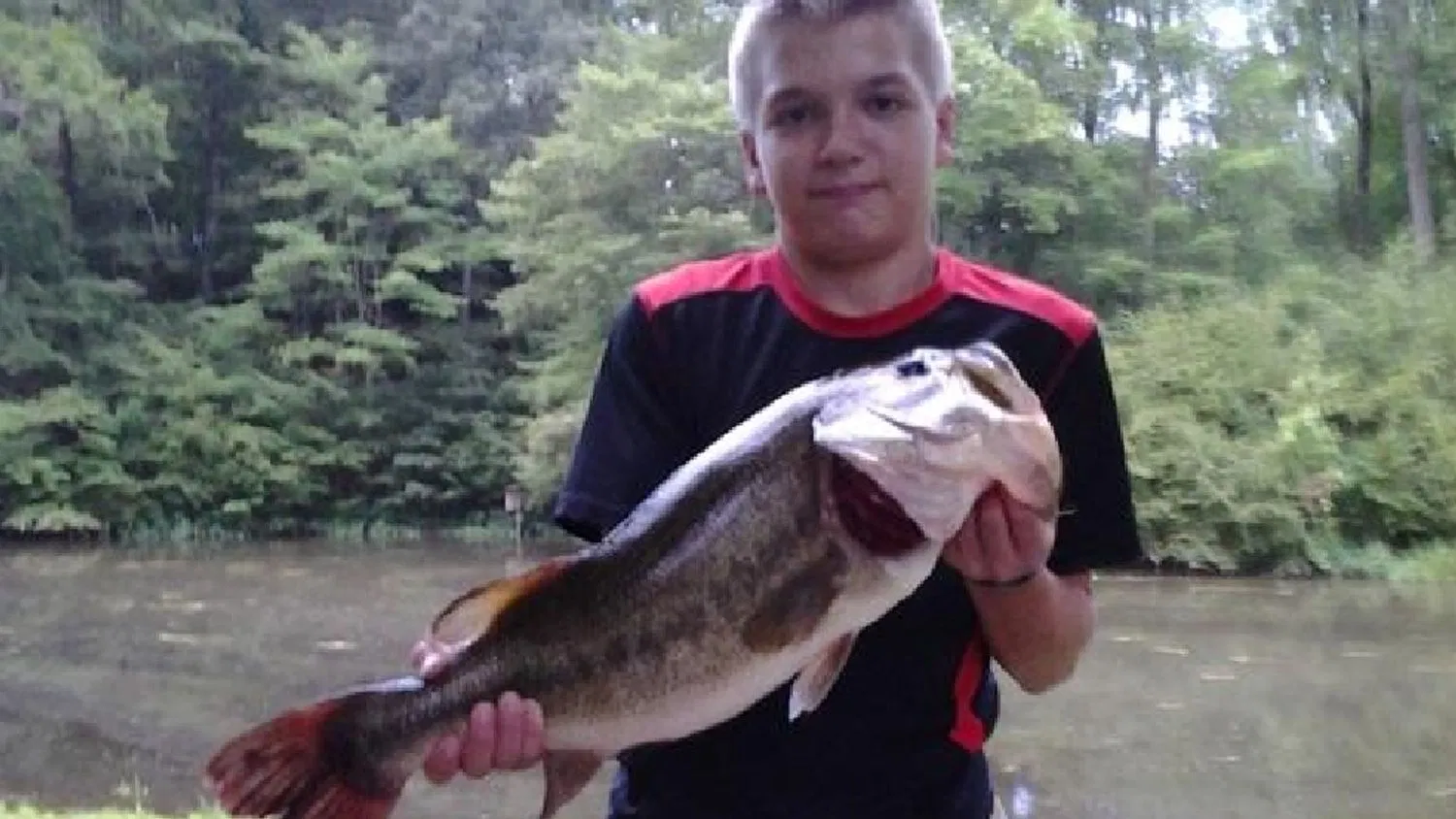 An angler poses with the Maryland state recored largemouth bass. 