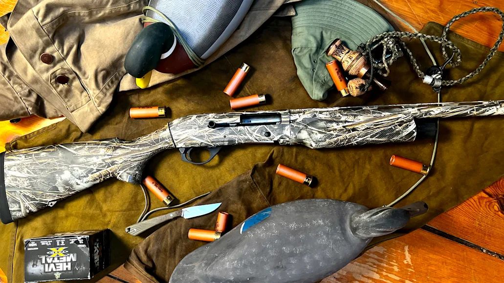 The new Spandau Arms S2 semi-auto shotgun on a wood surface with decoys and shells.