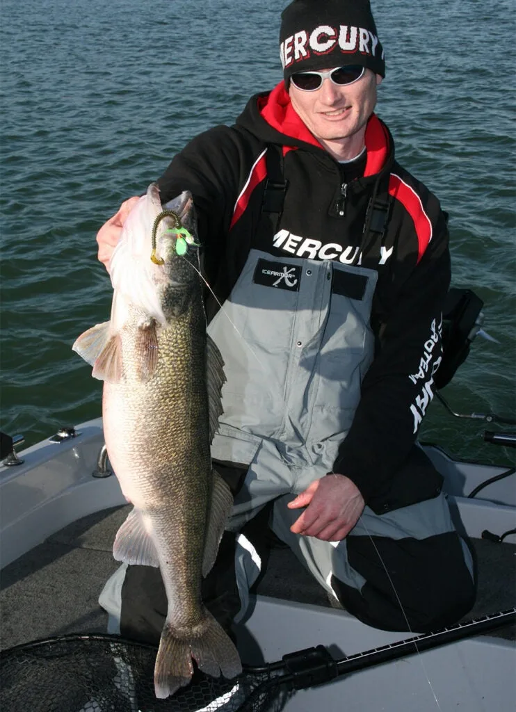 angler holding up giant walleye