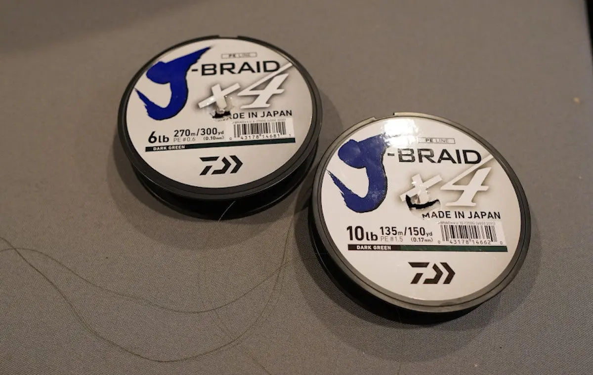 Daiwa J-Braid fishing line spools sitting on table