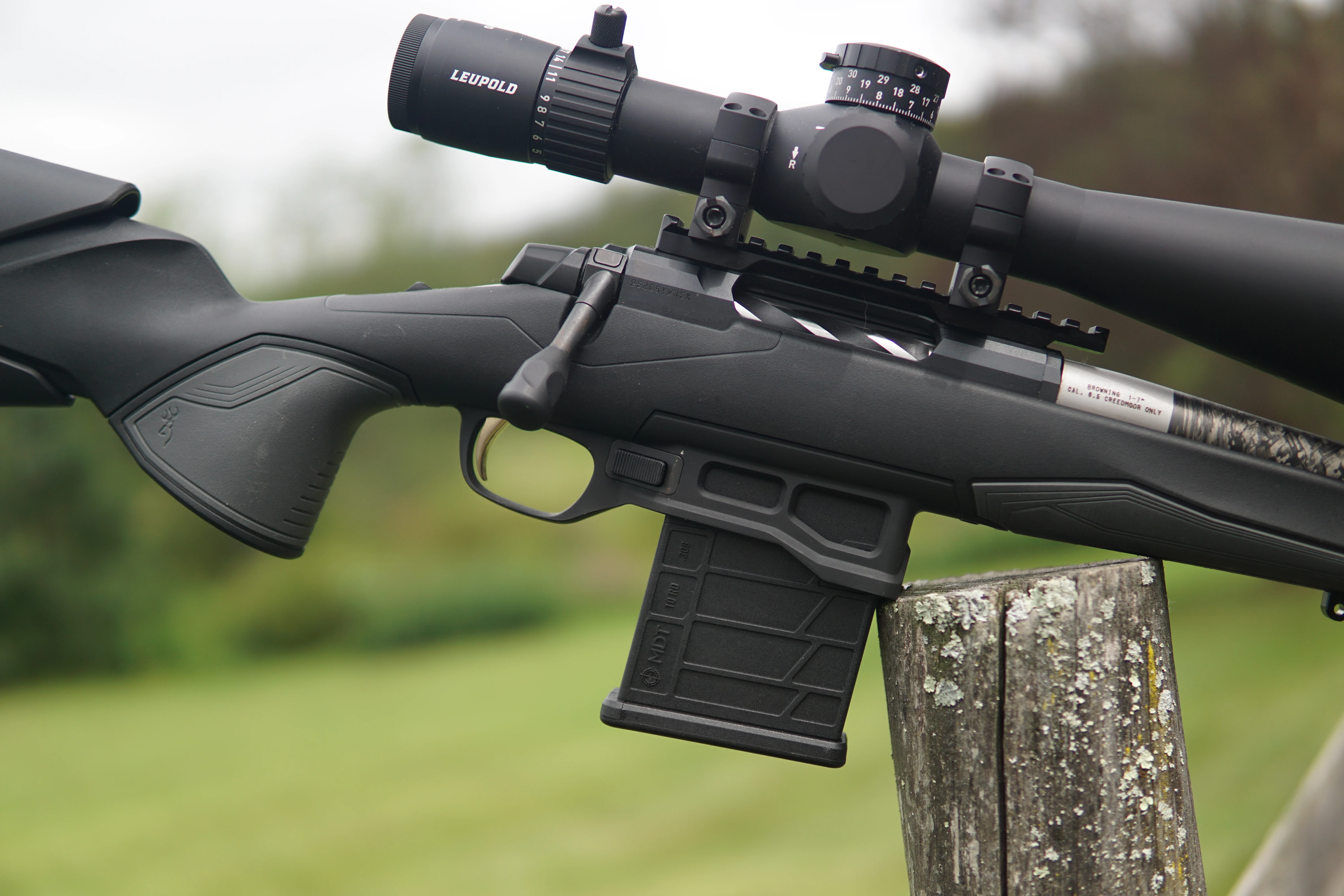 Browning X-Bolt 2 Competition Target Lite rifle balance on a fence post. 