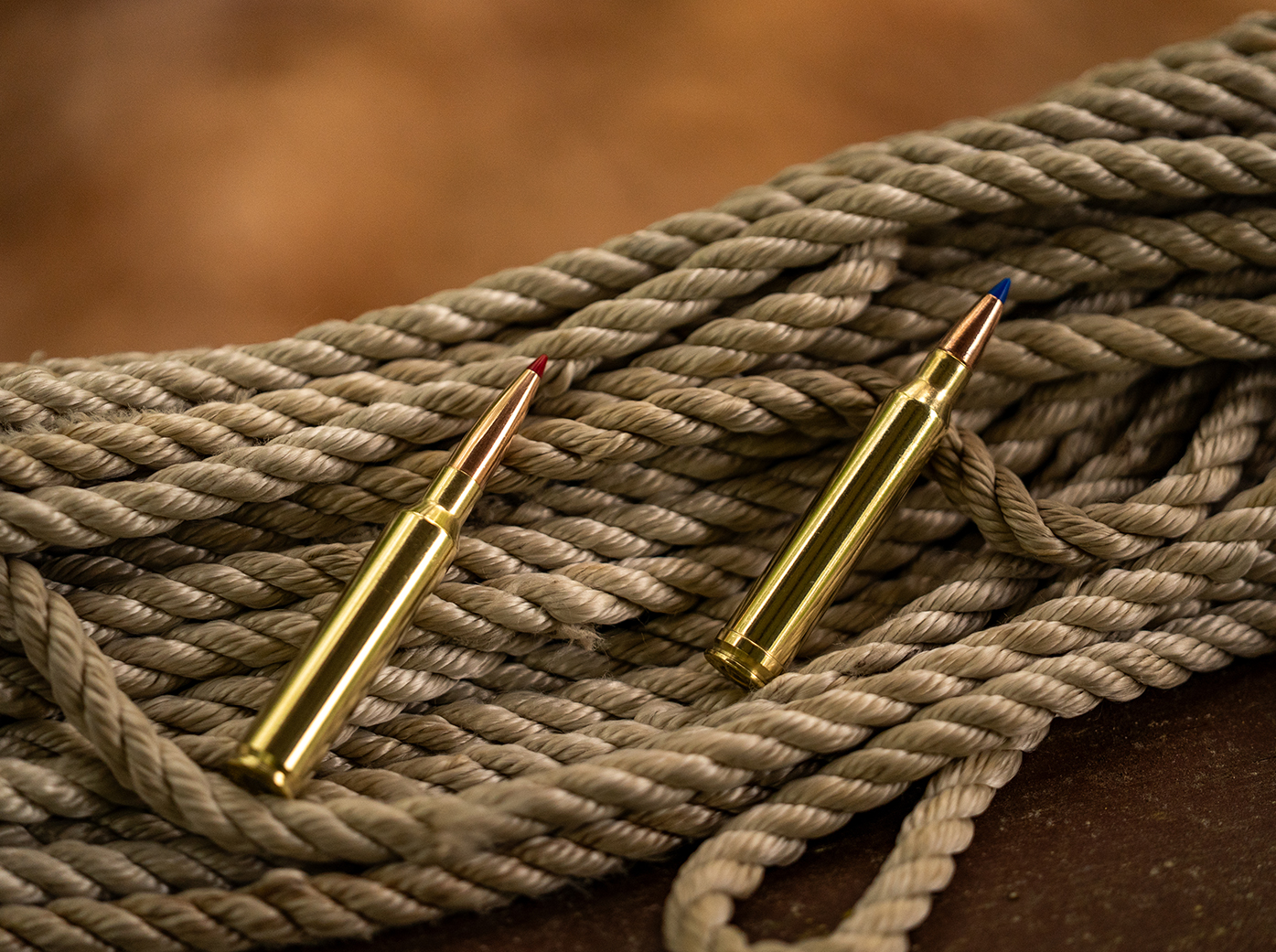 300 PRC vs 300 Win Mag: both cartridge laying on a bunch of rope.
