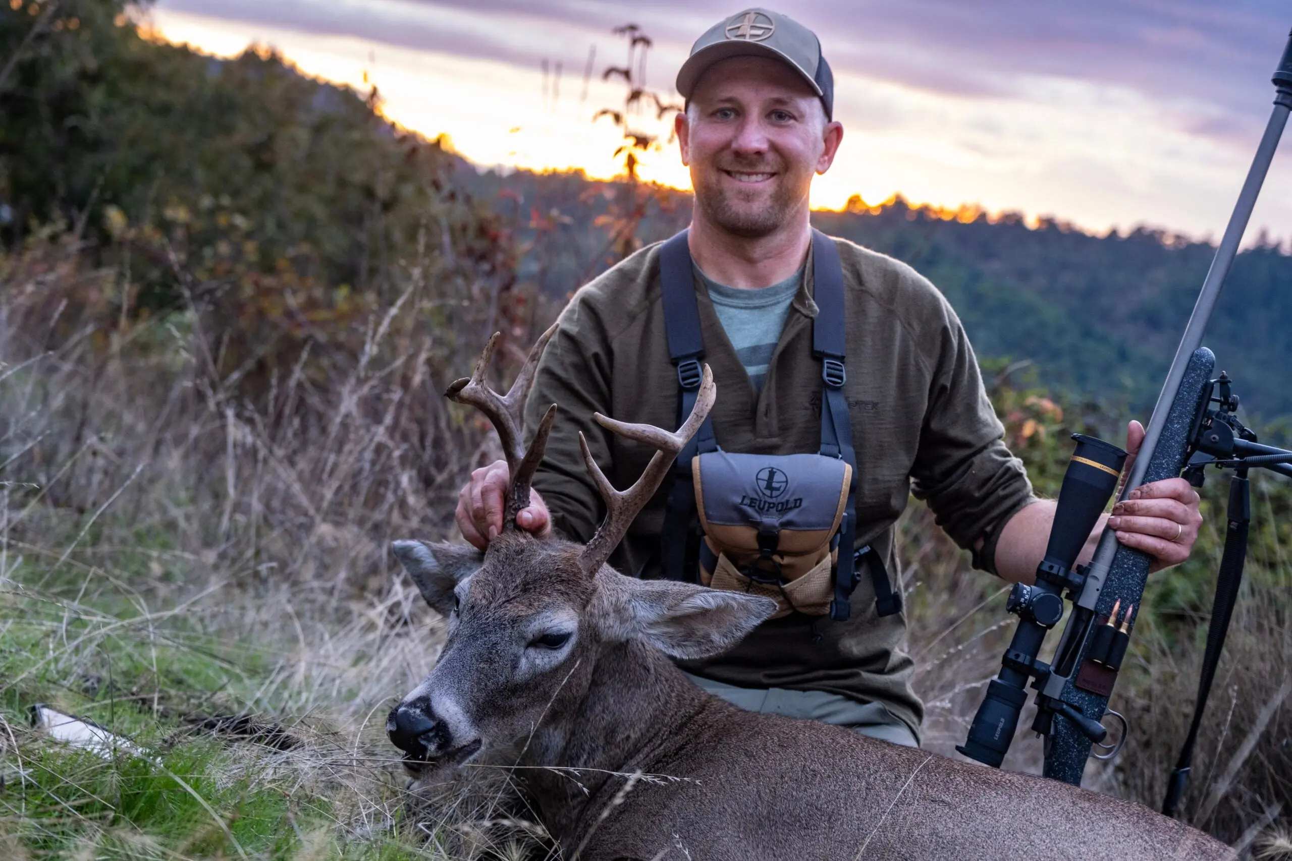 a hunter shows of a Columbian whitetail buck taken in western Oregon