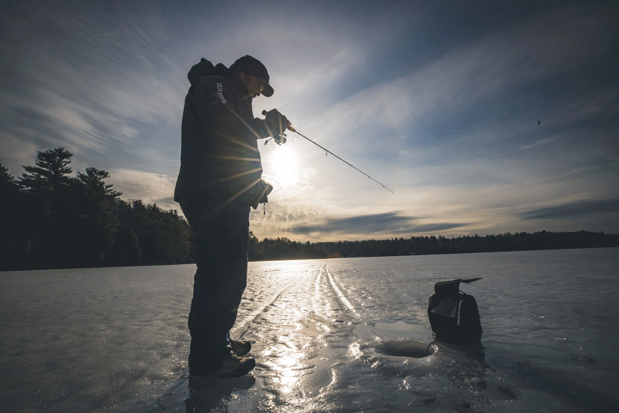 An angler jigs for through the nice while watching the sonar. 