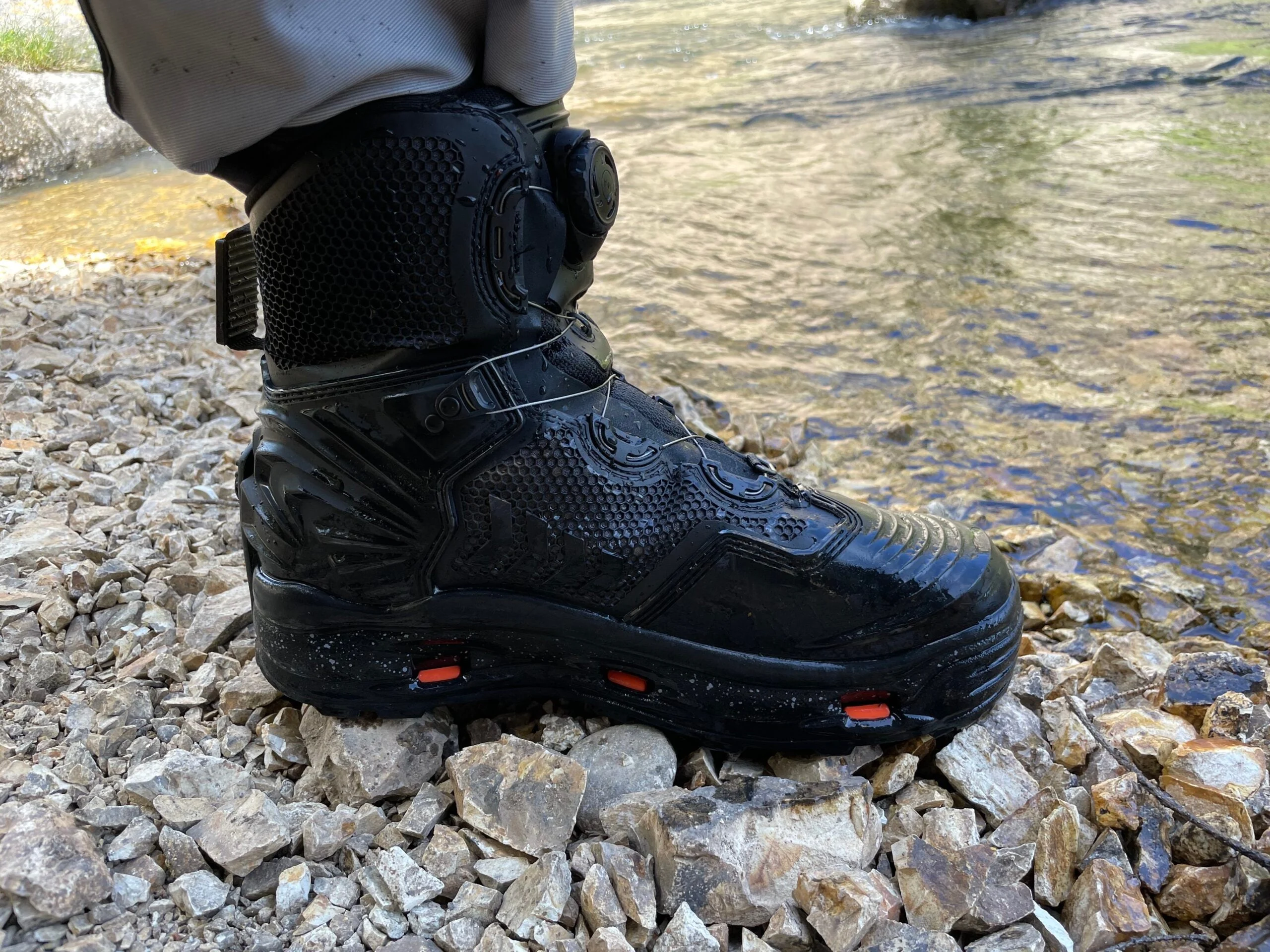 Angler wearing Korkers River OPS wading boots with BOA laces and interchangeable outsoles