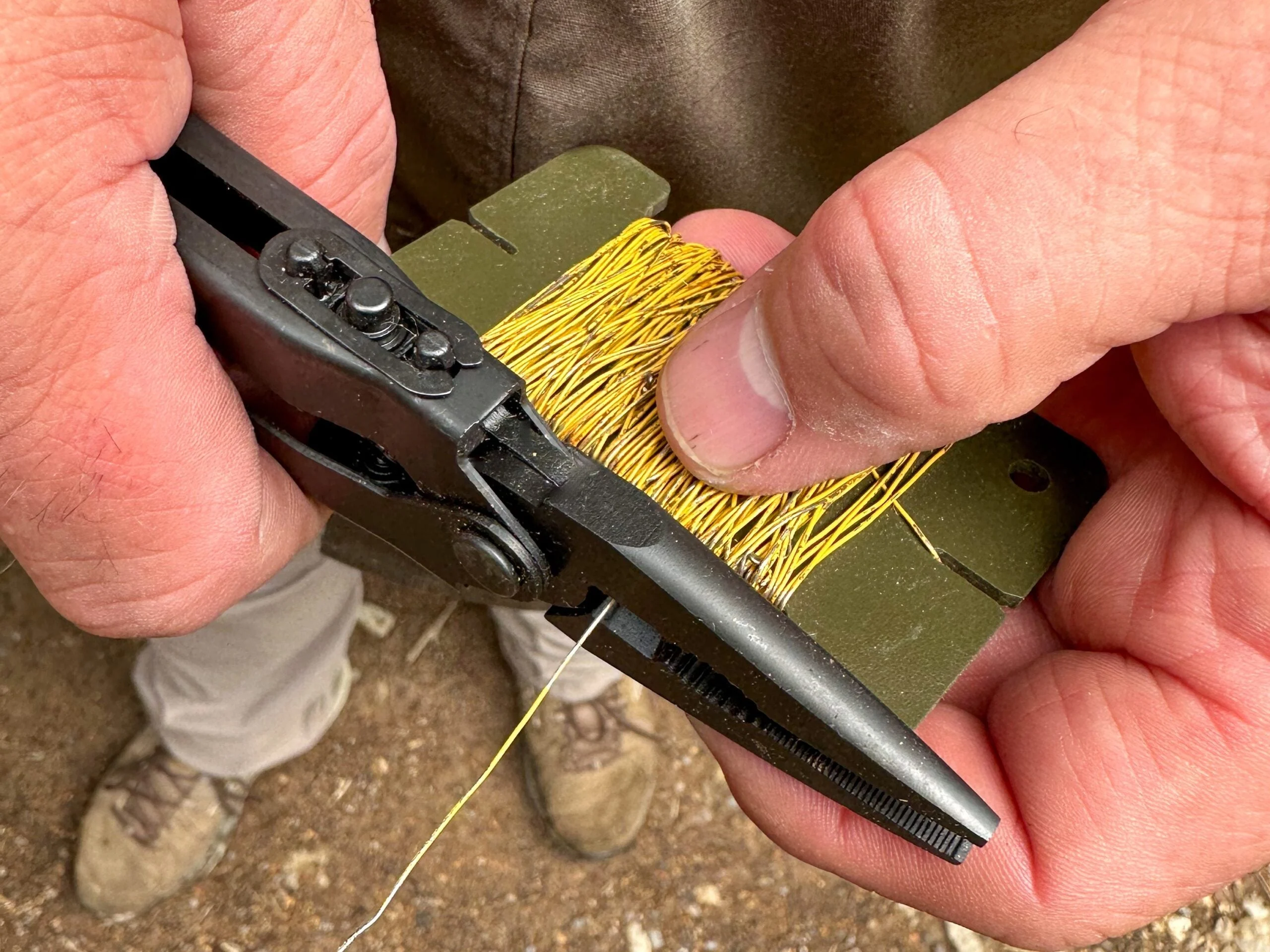 stripping wire to make a compass