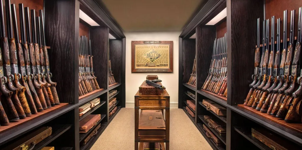 room full of classic shotguns and dangerous game guns. 