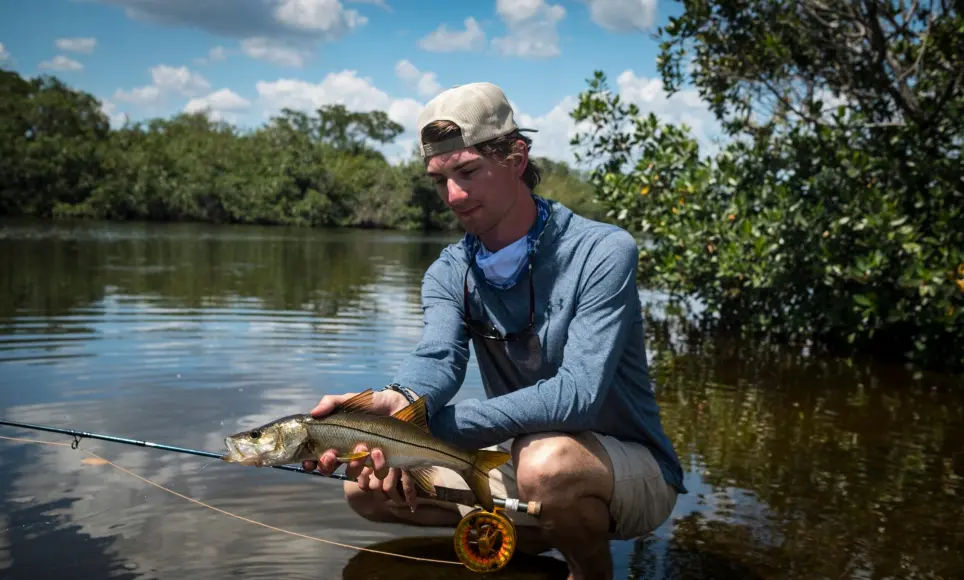 angler holding snook