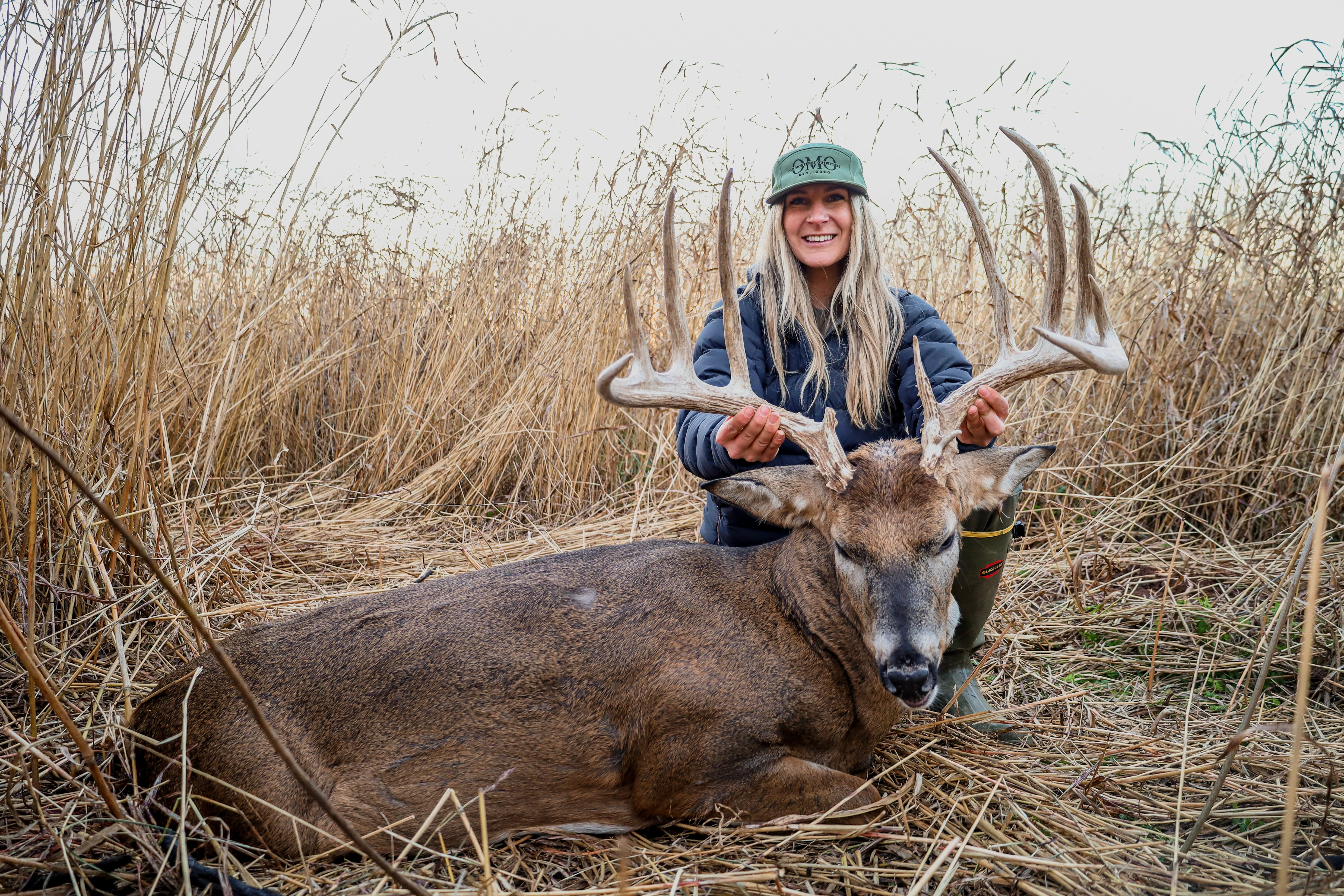 Oklahoma hunter Kelsie Harris poses with a trophy whitetail buck. 