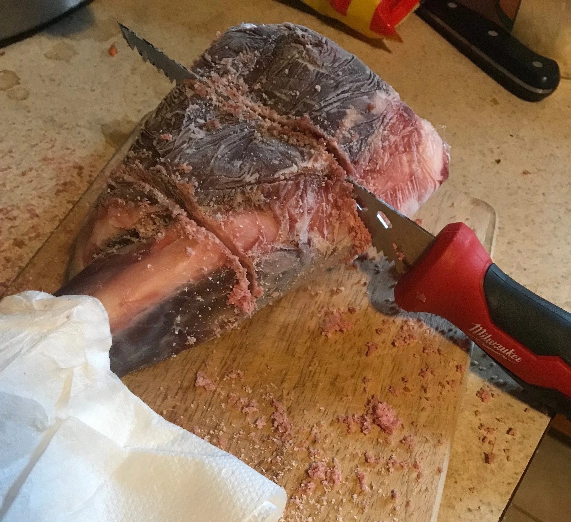 Saw cutting venison shank.