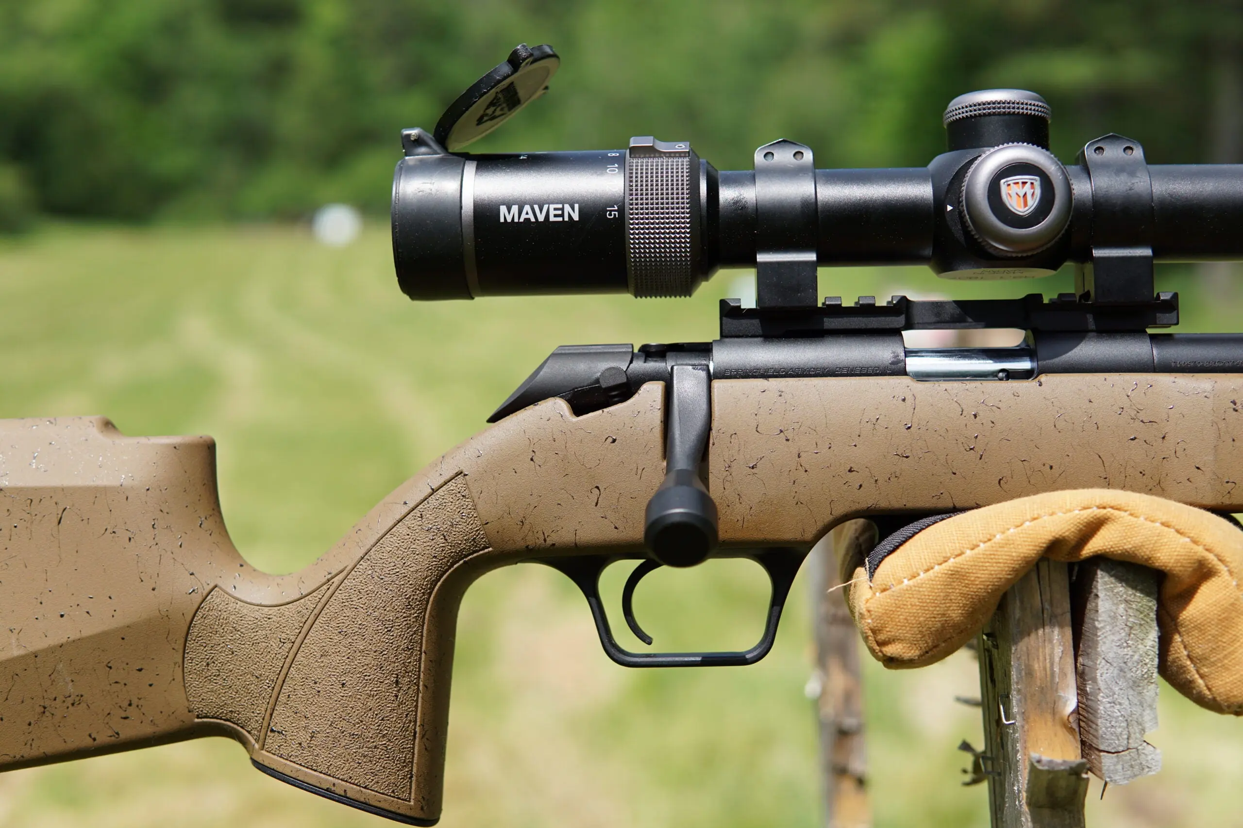 A close-up view of the Springfield Armory Model 2020 Rimfire rifle's bolt, trigger, and grip. 