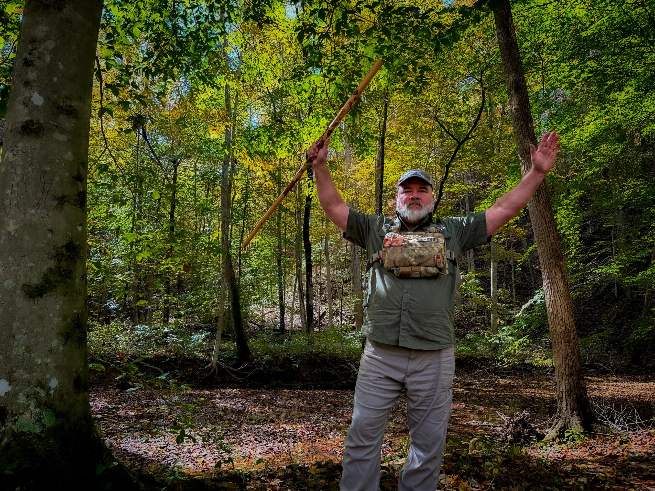 A hiker demonstrates how to wave your arms to prevent a mountain lion attack