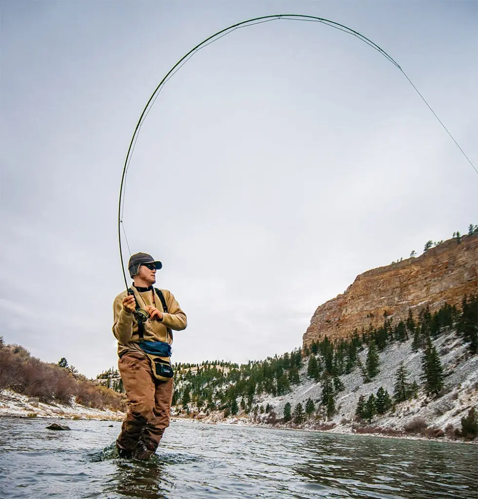 man fishing in stream