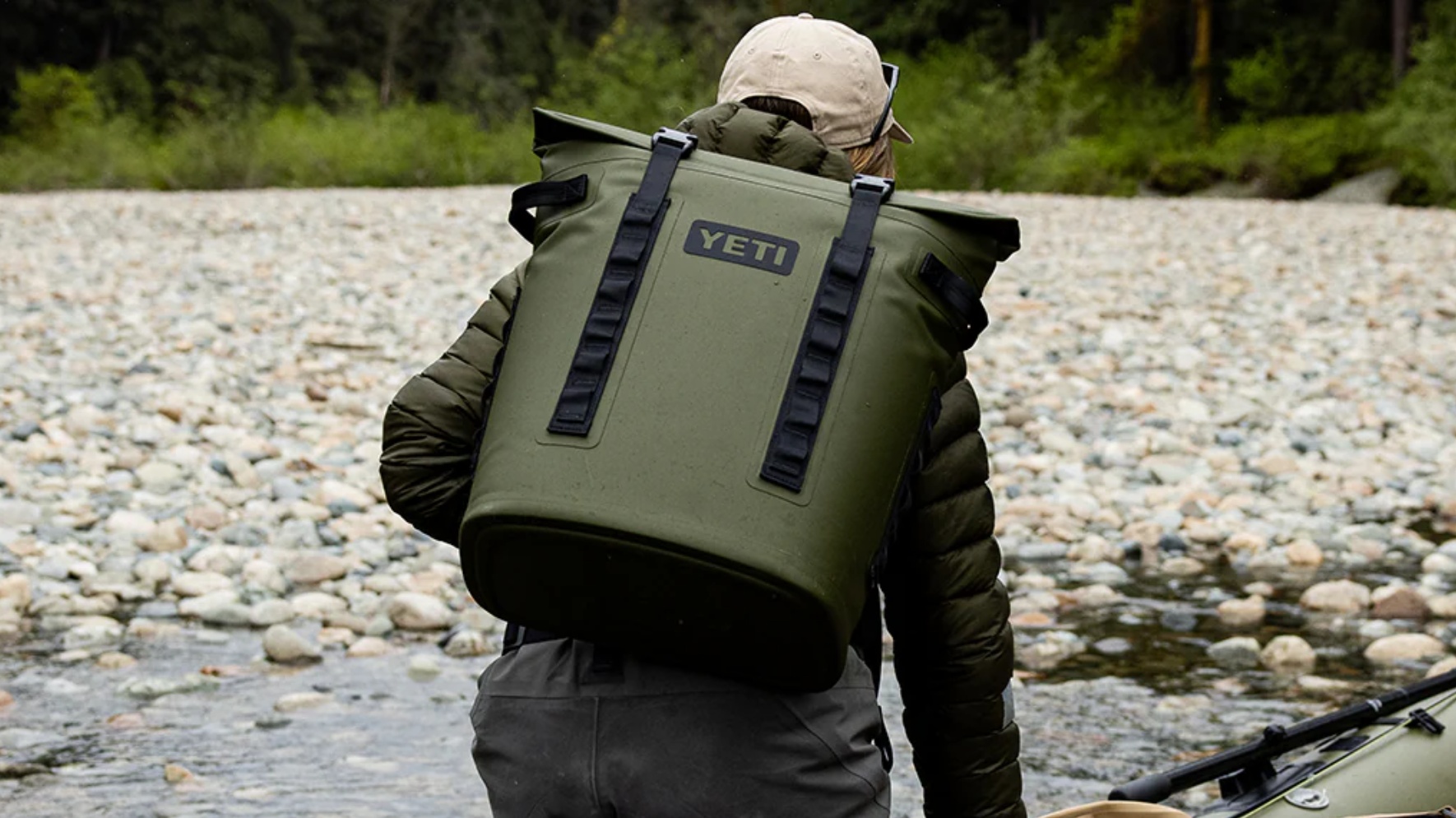 Angler wearing olive Yeti Hopper M20 Backpack Cooler