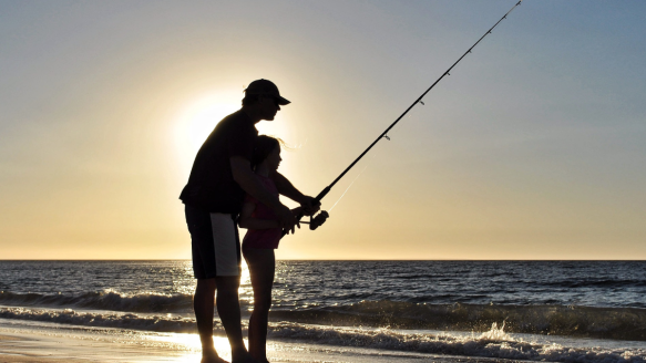 Dad fishing with daughter