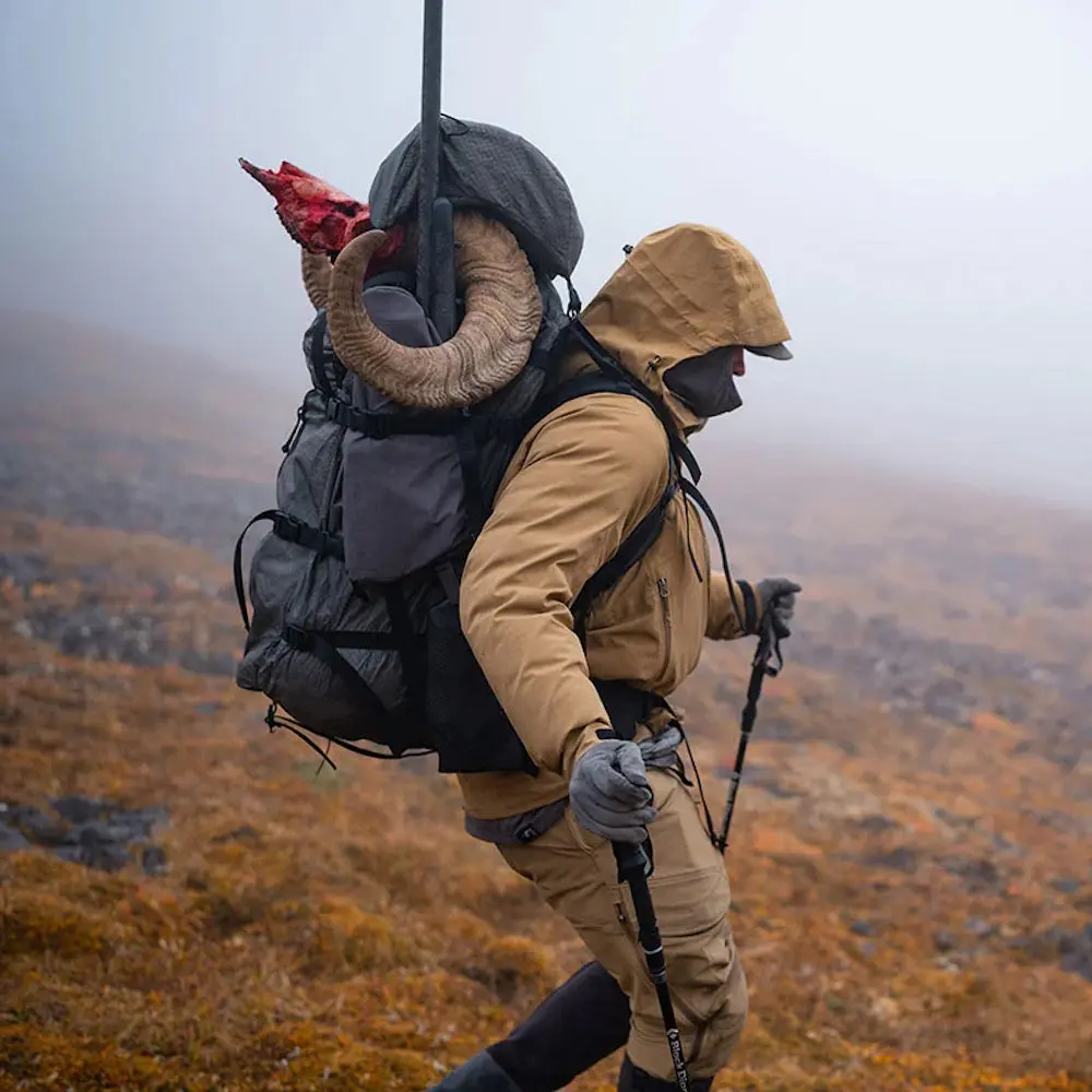 Hunter carrying ram's head in Stone Glacier Terminus backpack