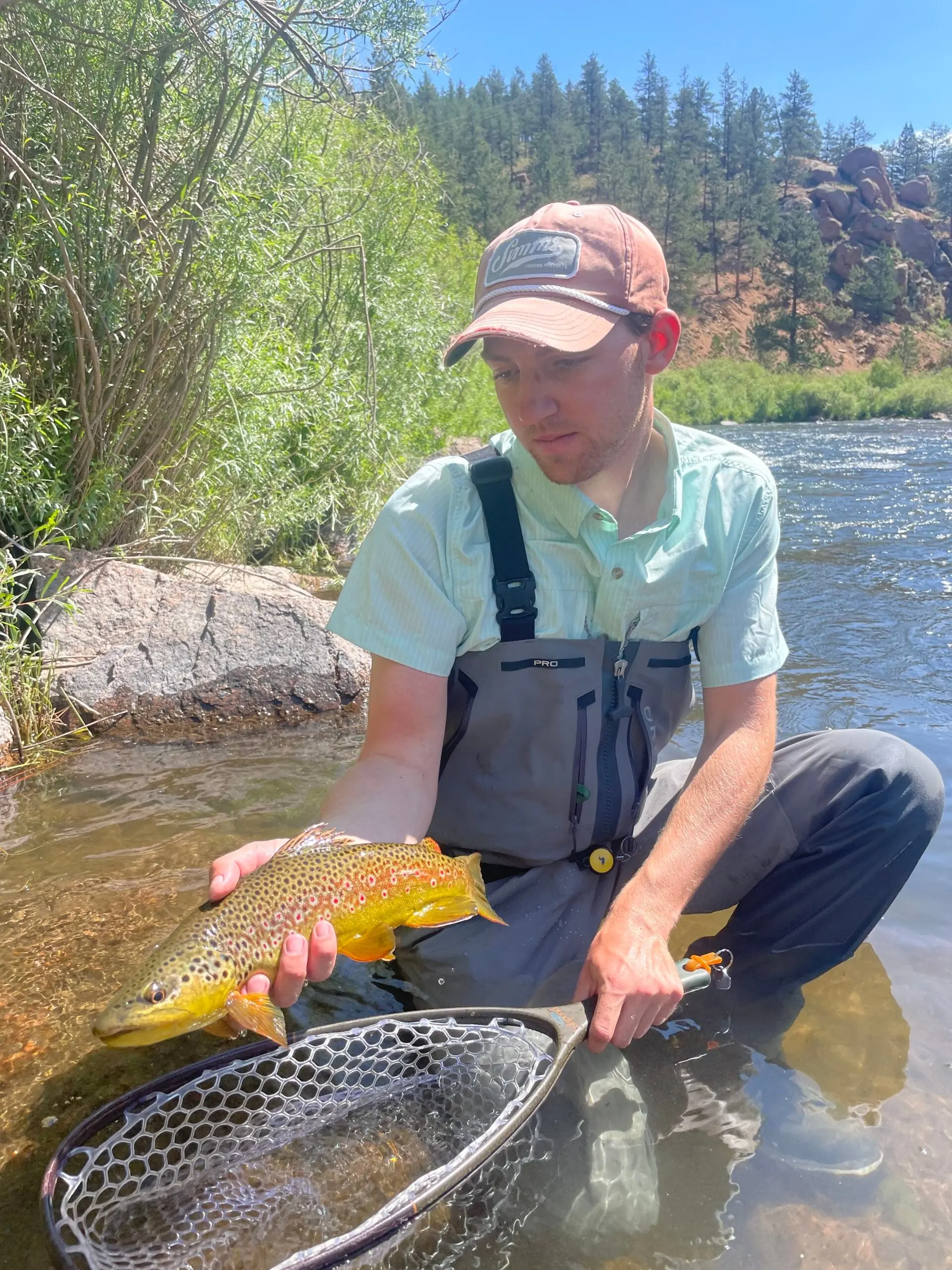 The author with a brown trout while testing the Patagonia x Danner