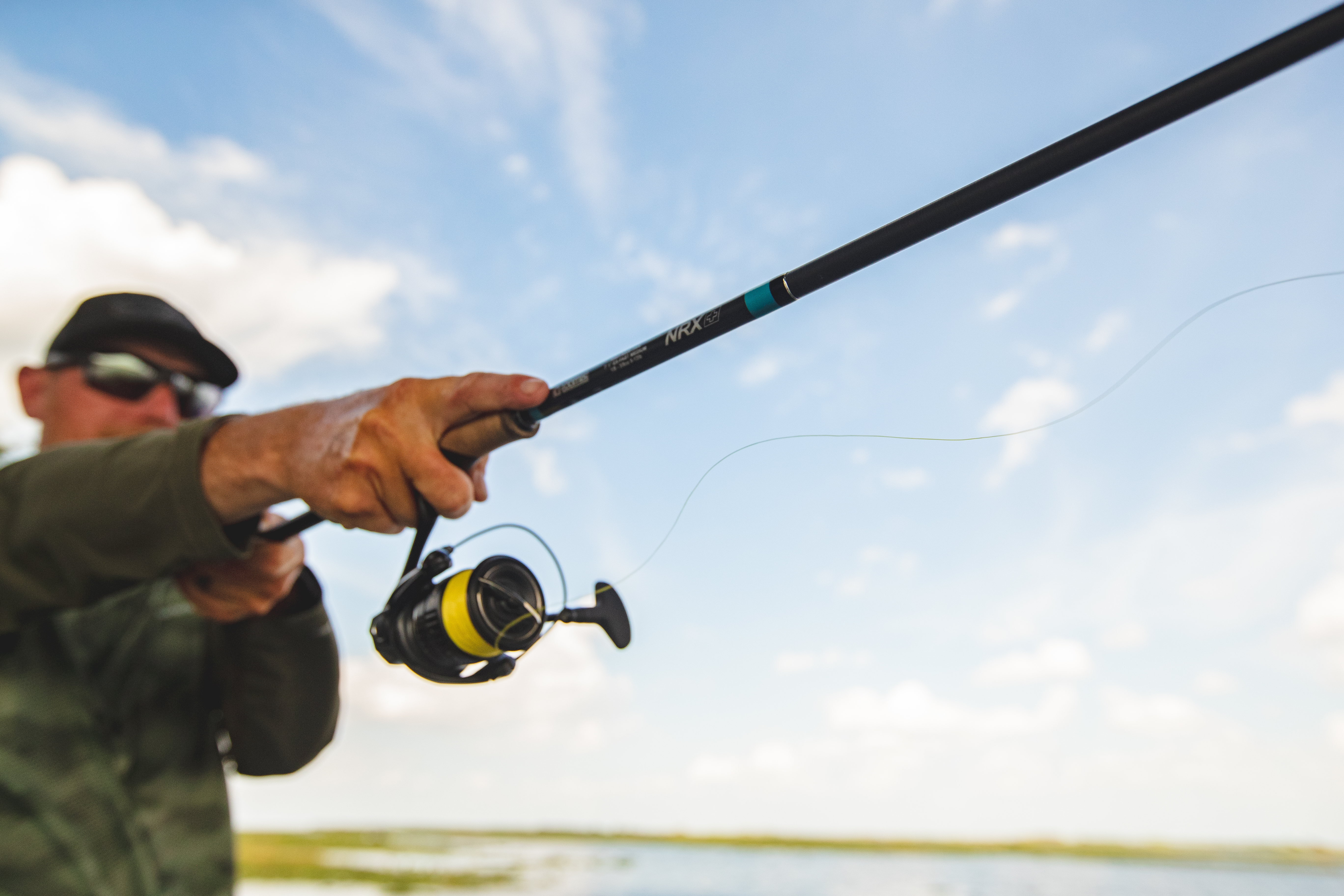 Angler casting a spinning reel